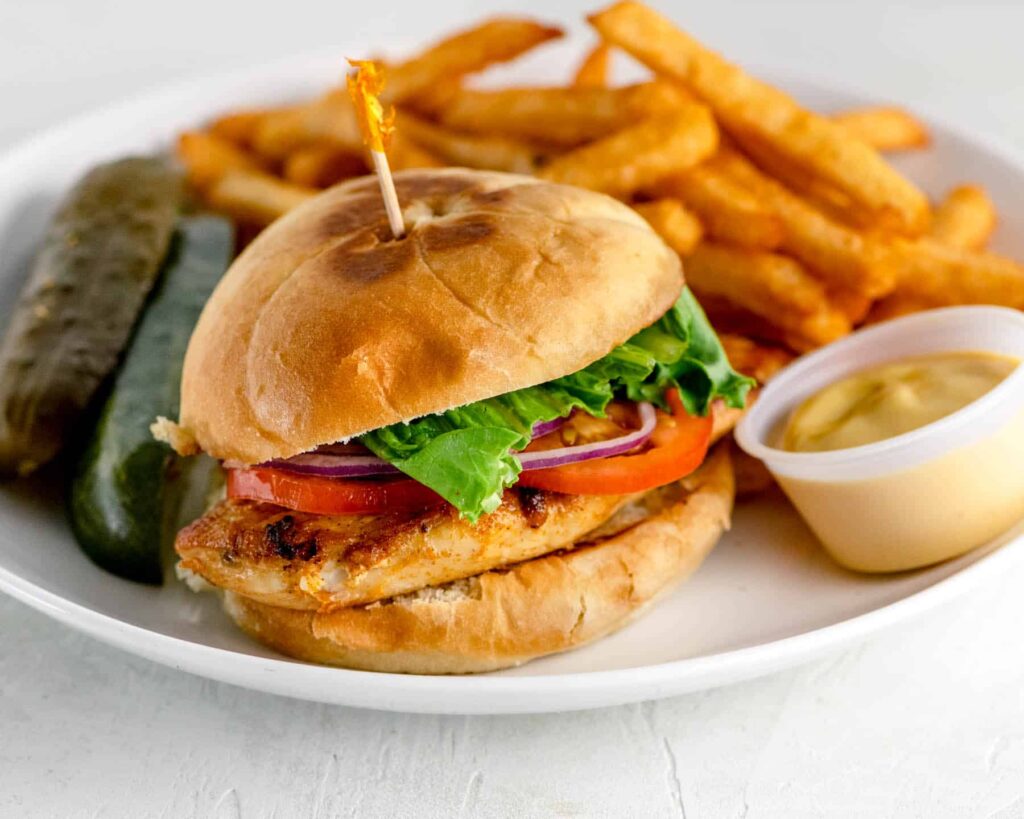Grilled Chicken with lettuce, tomato, onion with honey mustard  and fries